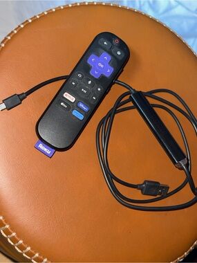 Roku Streaming Stick with Black Remote and Purple Navigation